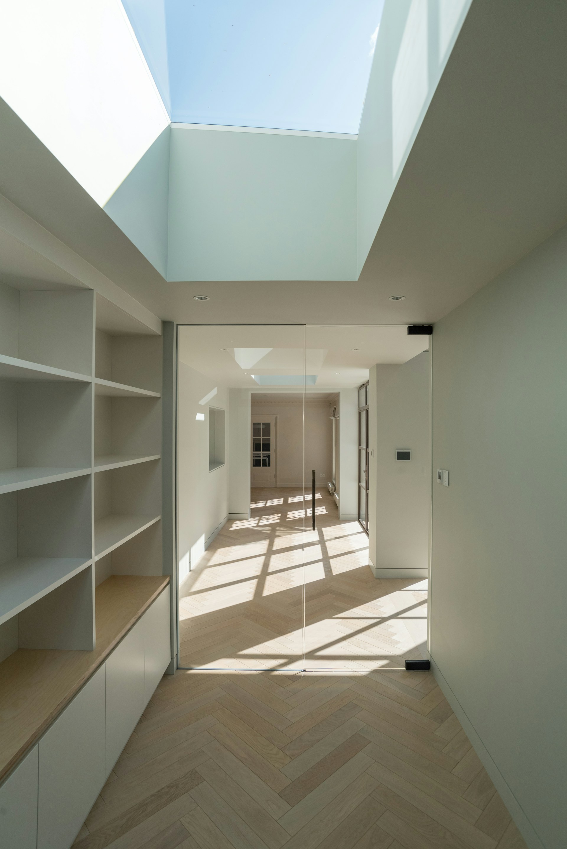 Renovated interior with built-in cabinetry and finished wood flooring