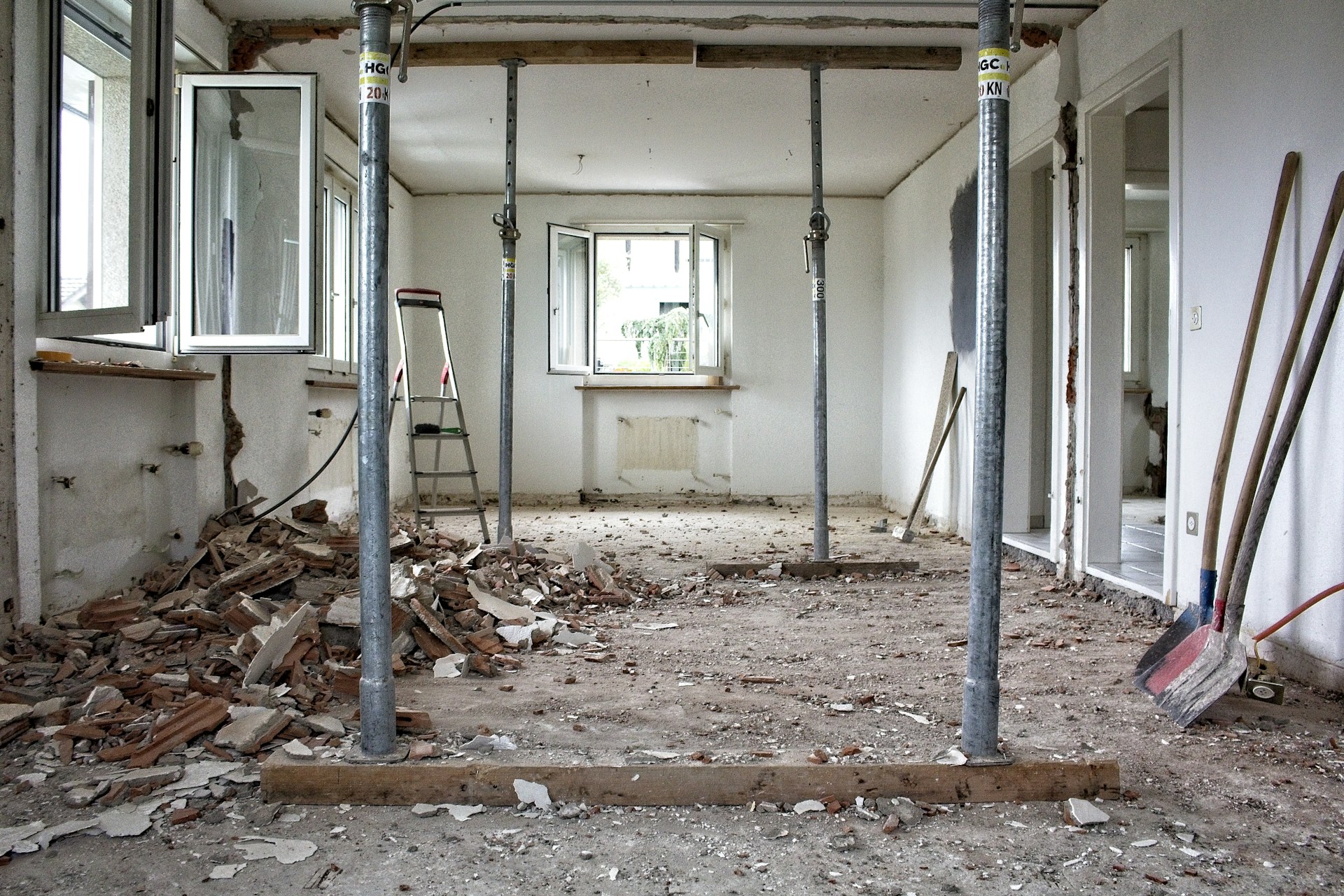 Actual interior renovation in progress with exposed surfaces and temporary supports